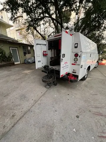 Magnet Plumbing service vehicle on-site for Grease Trap Cleaning in Homer
